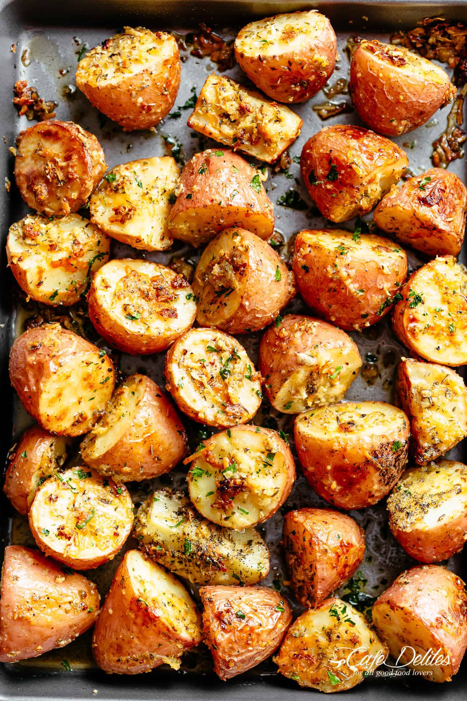 Herbs, garlic, and parmesan cheese are roasted together to make the best Crispy Browned Butter Parmesan Roasted Potatoes!