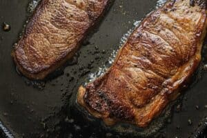 Searing the steaks.