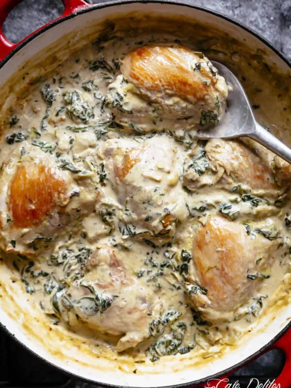 Creamy Spinach Artichoke Chicken Thighs in one skillet! Low fat and low carb, filled with fresh spinach, artichokes, parmesan cheese and a hint of garlic!