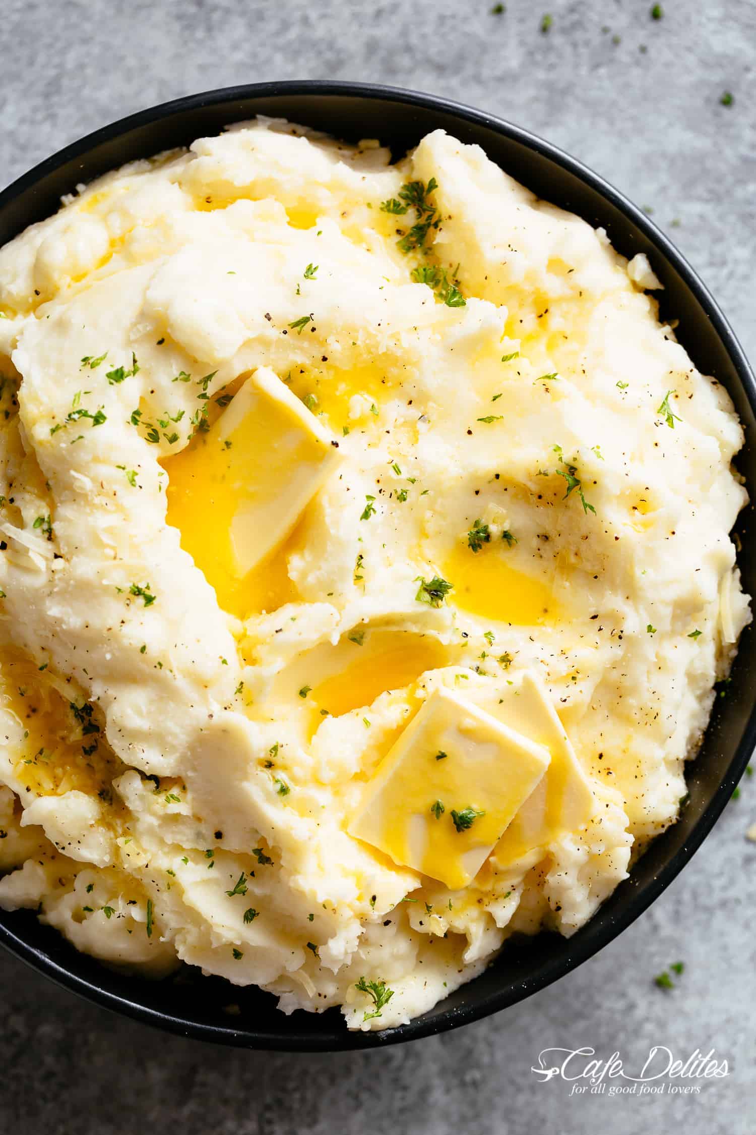 Mashed potatoes with melted butter in a bowl 