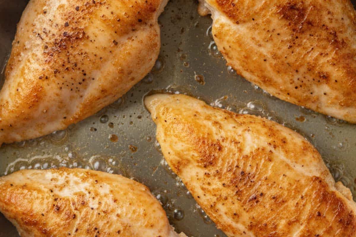 Searing the chicken.