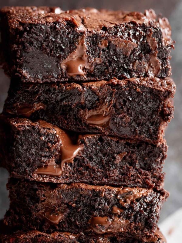Fudgy and buttery brownie pieces stacked on top of each other