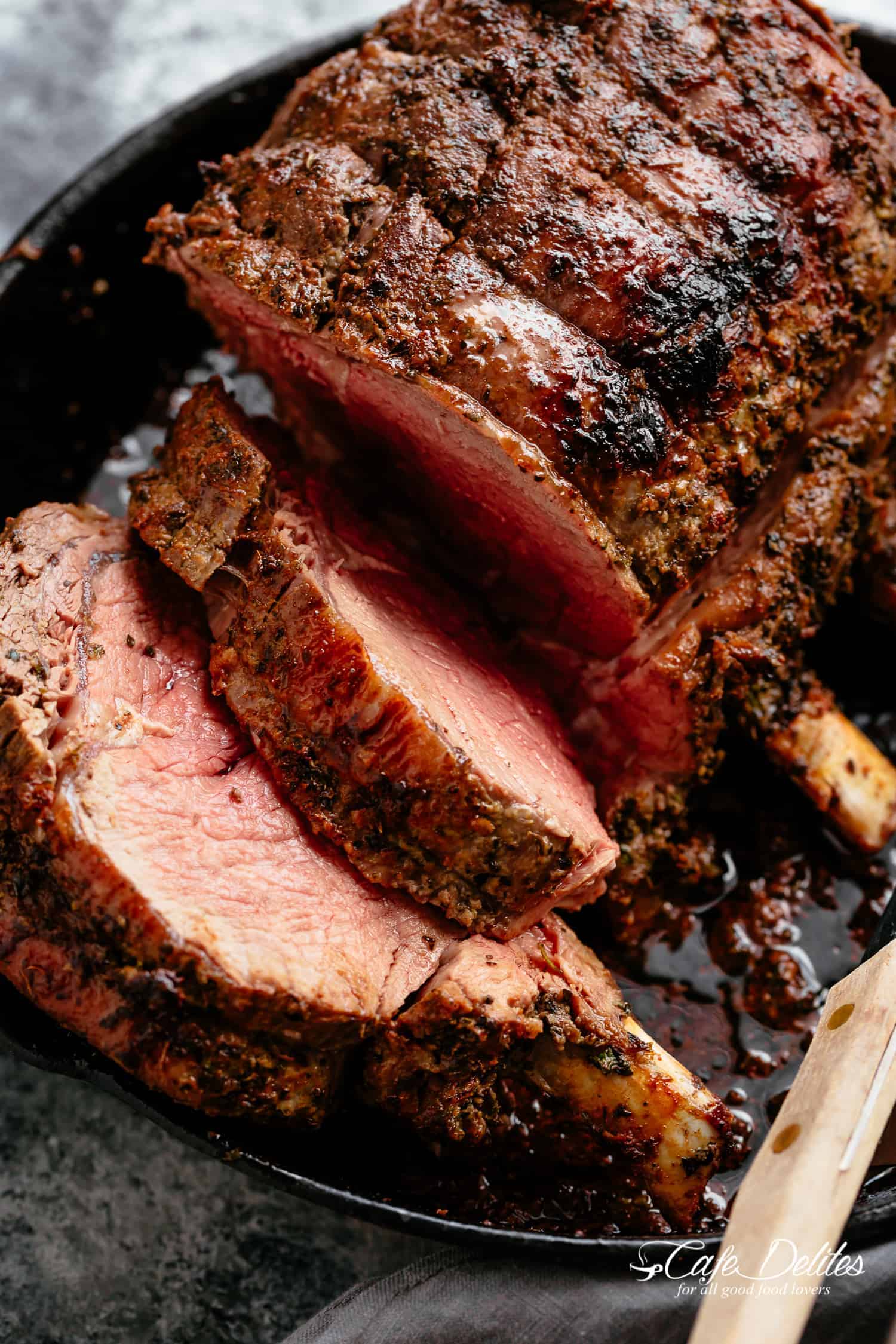 Garlic Herb Prime Rib Roast Slices full of flavor on a pan