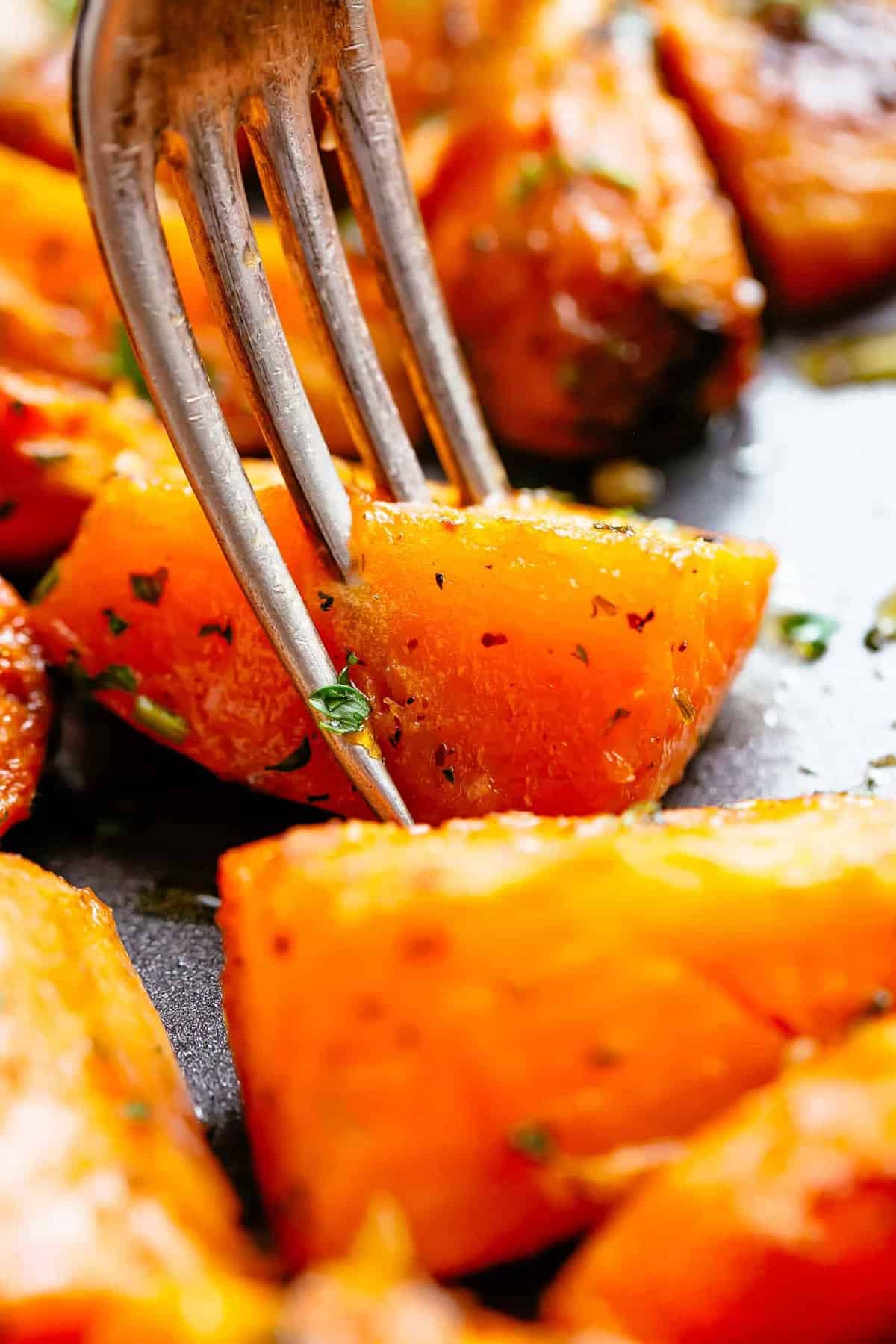 roasted potato being hold with a fork
