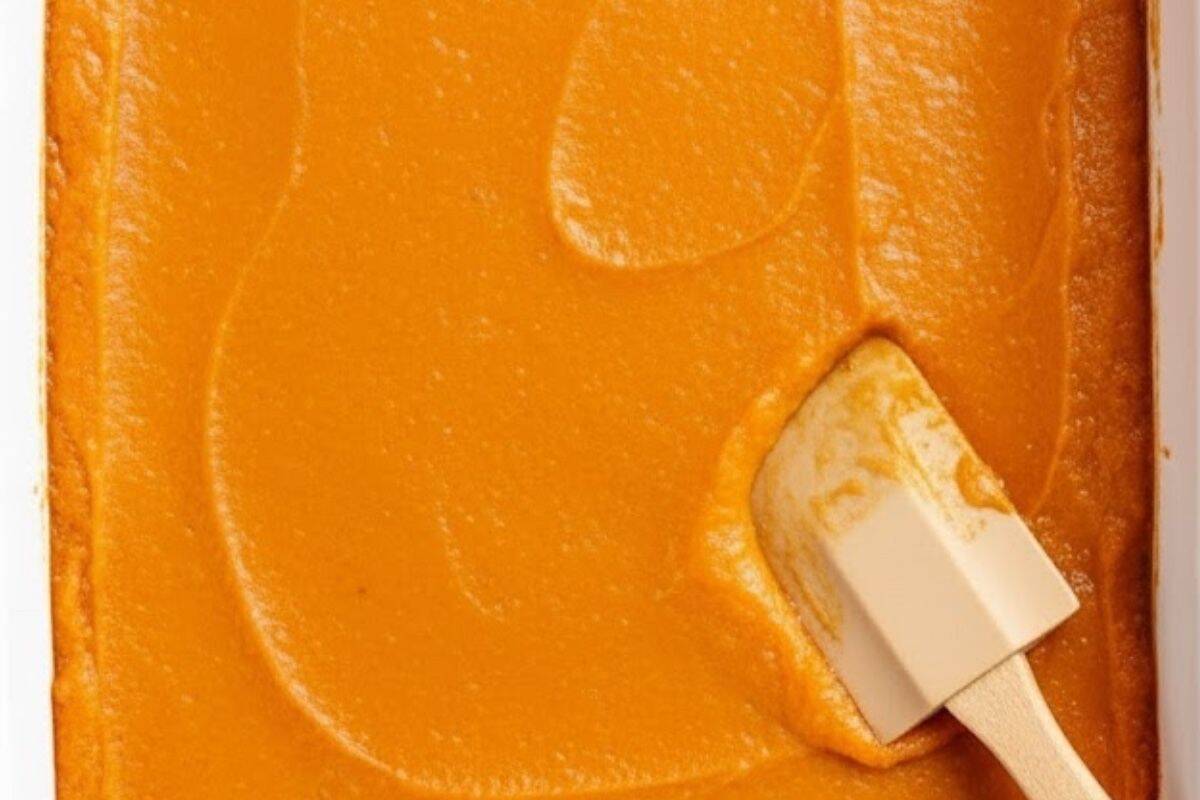 Pour the sweet potato mixture into the prepared baking dish, spreading it evenly with a spatula.