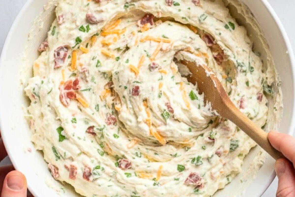 In a large bowl, combine all the dip ingredients—cream cheese, bacon, cheddar, herbs, and seasonings