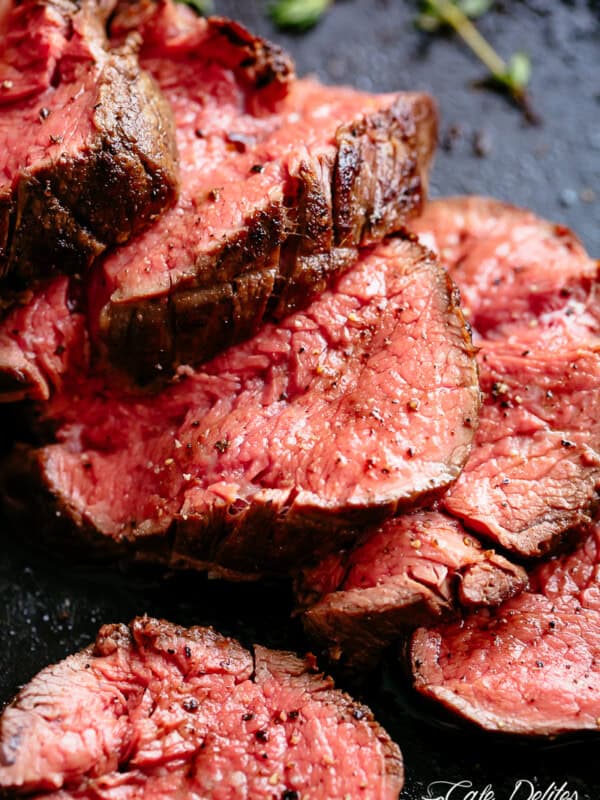 The best, juicy roast Beef Tenderloin slathered with garlic butter that melts in your mouth with every bite! Even better when served with a rich and rustic, easy to make red wine sauce (or jus).