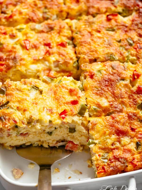 Yummy Breakfast Casserole with shredded potato hash browns, sausage, bacon and mozzarella cheese.