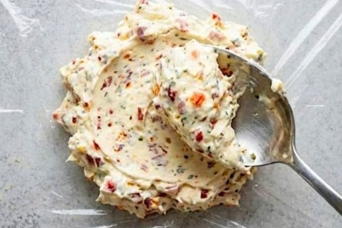 Lay non-stick plastic wrap on a clean surface. Spoon cream cheese onto the center and cover with another sheet of plastic wrap