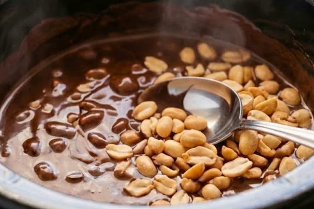 Once fully melted in the slow cooker, give the mixture a thorough stir. distribute the peanuts are evenly.