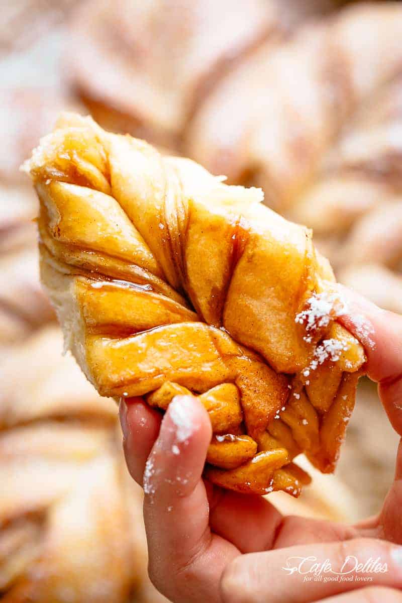 A piece of Cinnamon Star Bread in hand