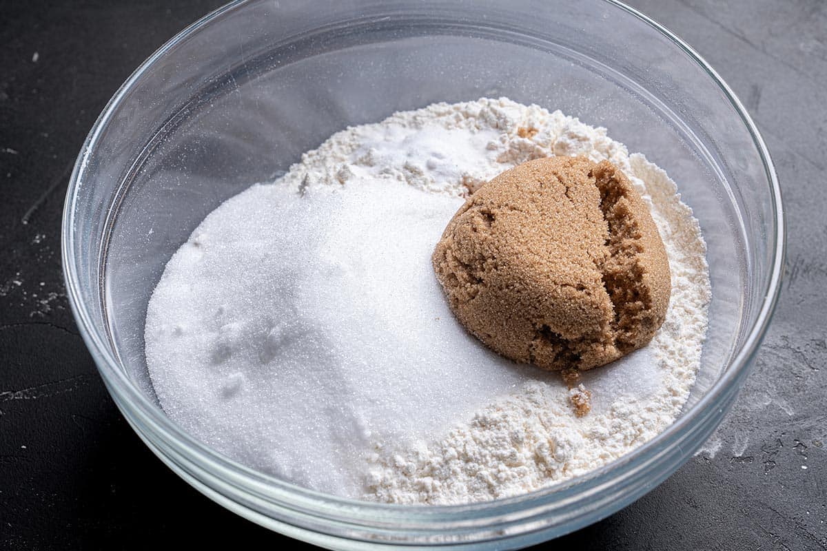 flour, sugars, baking soda, salt, and cinnamon mixed in a bowel