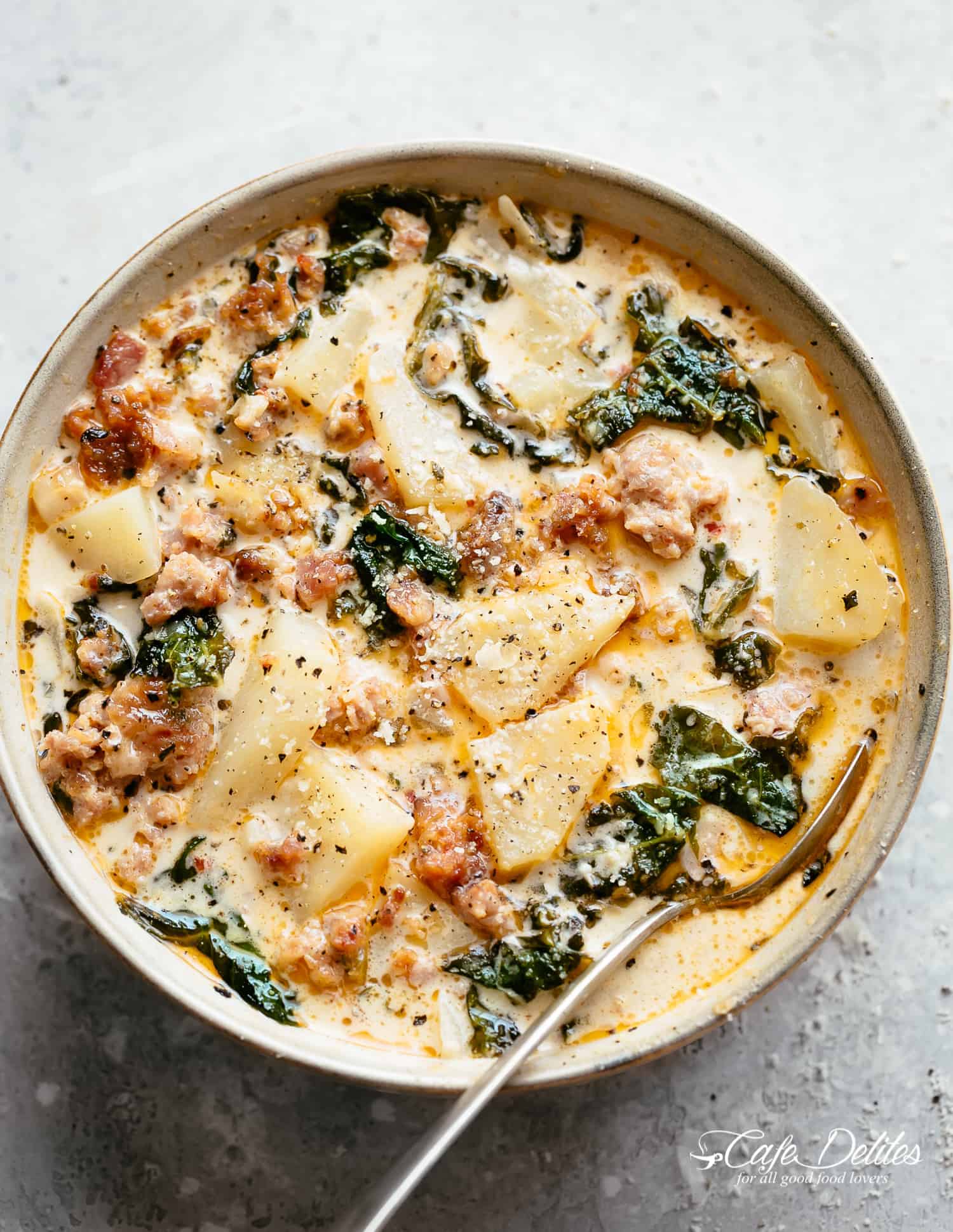 Zuppa Toscana recipe with sausage, bacon, kale and potatoes | cafedelites.com A bowl of Zuppa Toscana with sausage, bacon, kale and potatoes