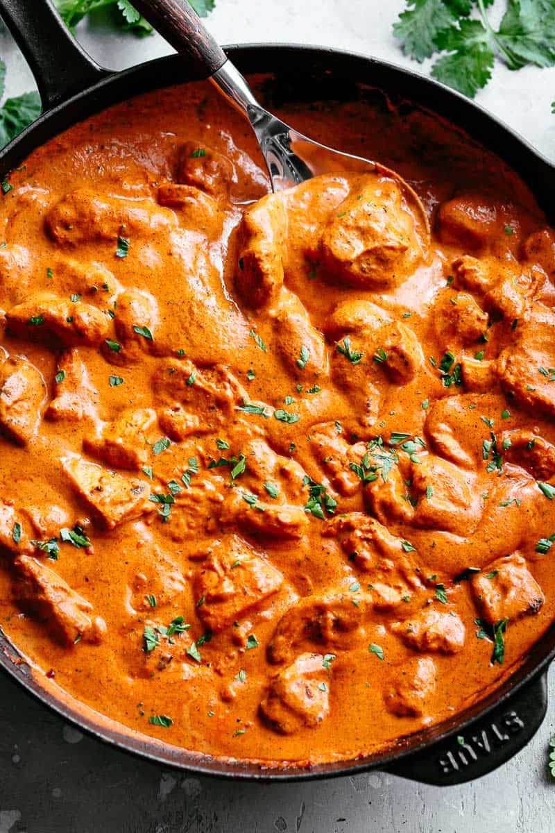 A super easy, full flavoured Butter Chicken with aromatic golden chicken pieces in an incredible curry sauce. | cafedelites.com