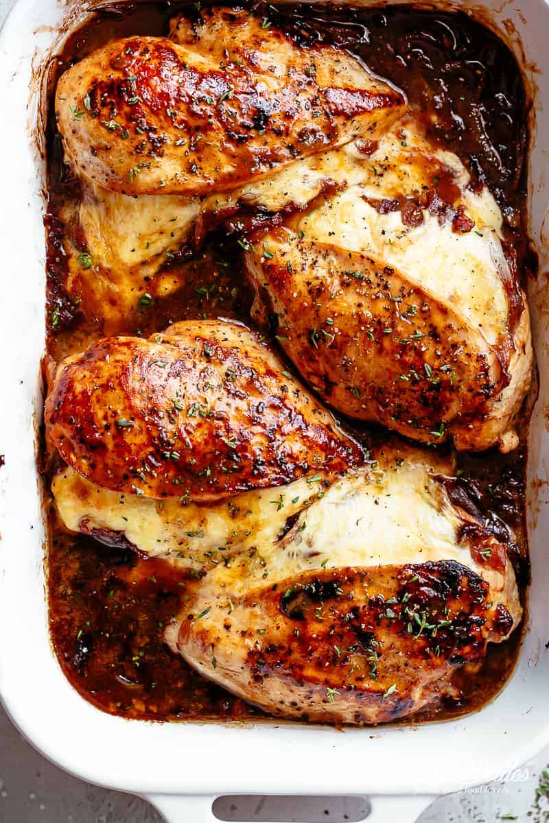 Juicy French Onion Stuffed Chicken Casserole on a baking tray