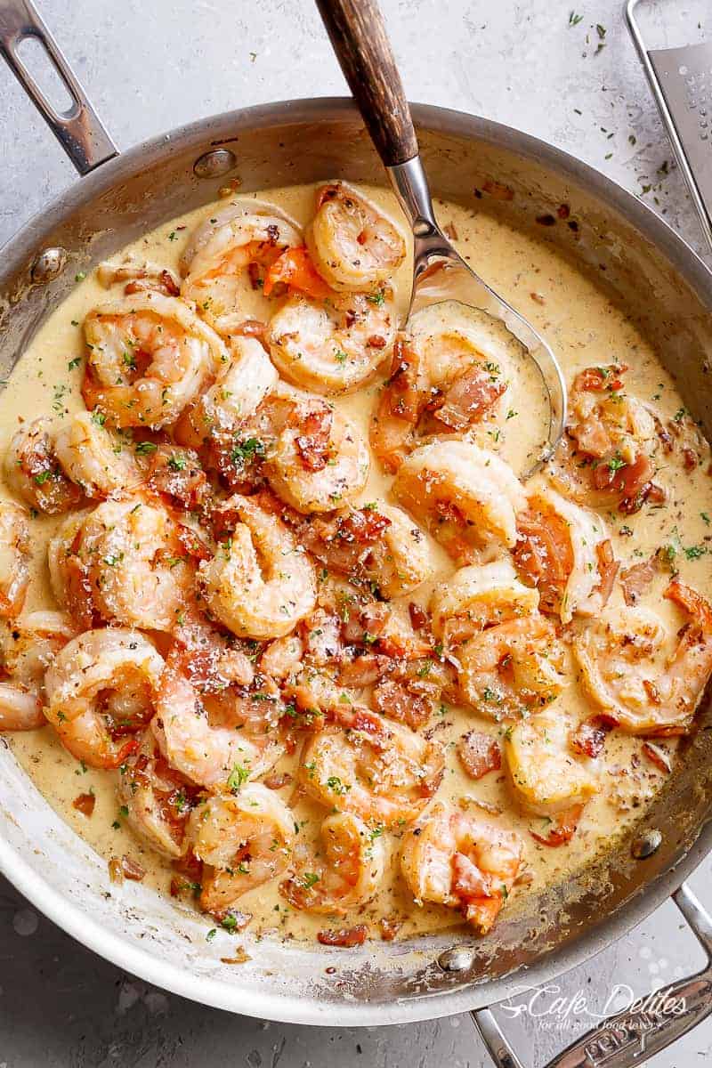 Bacon Shrimp Alfredo in a skillet with a parmesan cream sauce #cafedelites #shrimp #Alfredo Top view of Carbonara inspired Bacon Shrimp Alfredo in a pan