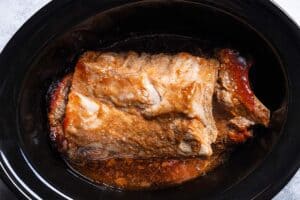 Very juicy cooked baby back ribs in the slow cooker.