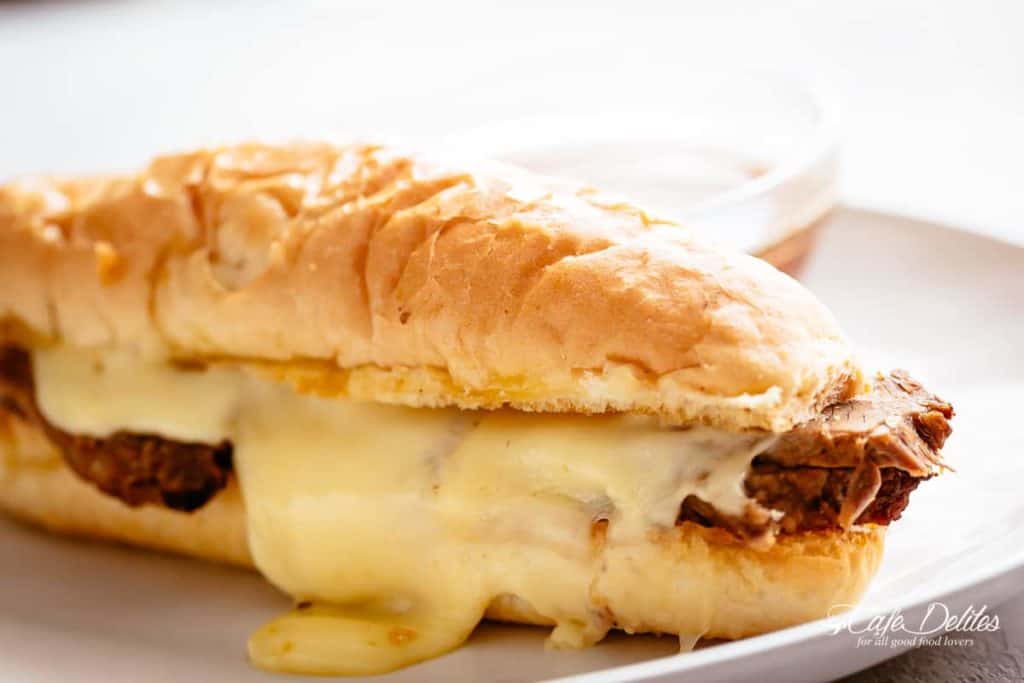 French Dip sandwich #cafedelites #Frenchdipsandwich #sandwich #French #dip #recipe #slowcooker #instantpot Side view of French Dip Sandwich kept on a plate