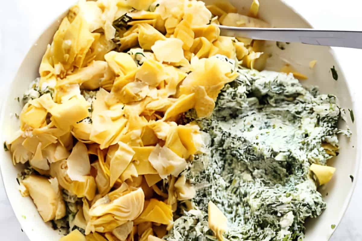 Spinach, cream cheese, chopped artichokes, mozzarella, parmesan, garlic,and pinch of salt mixed together in a bowl,
