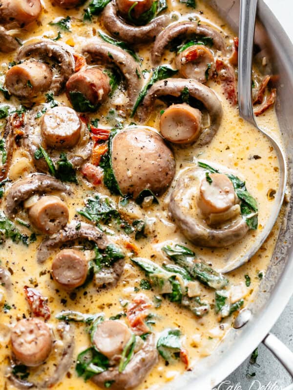 Creamy Garlic Butter Tuscan Mushrooms in a bowl and spoon