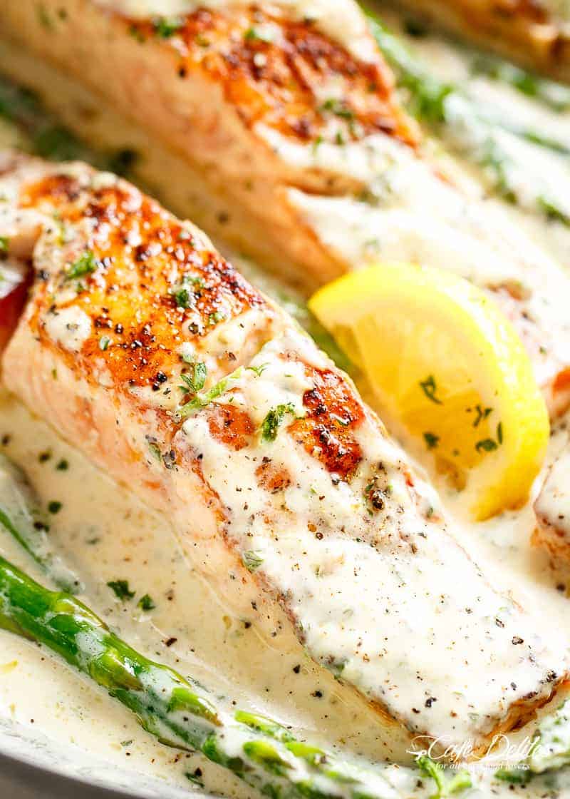 Salmon with Creamy Dijon Sauce and lemon wedges