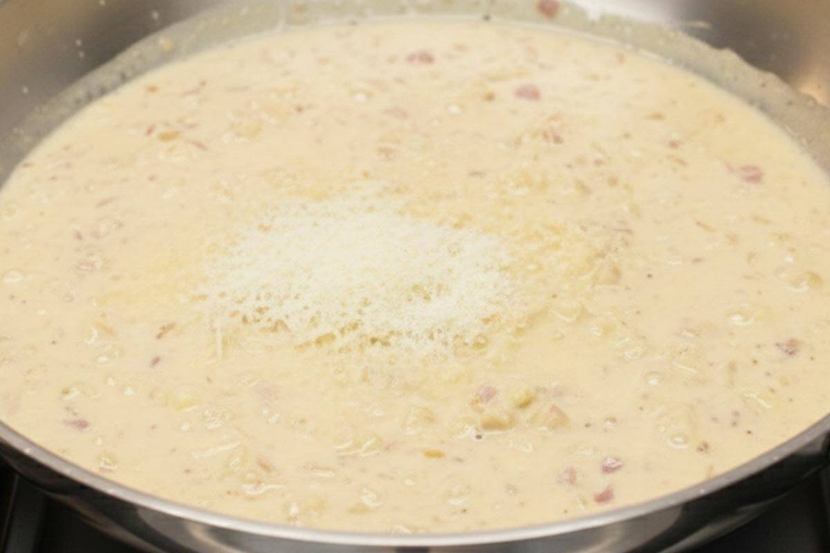Making the garlic cream sauce in the skillet.