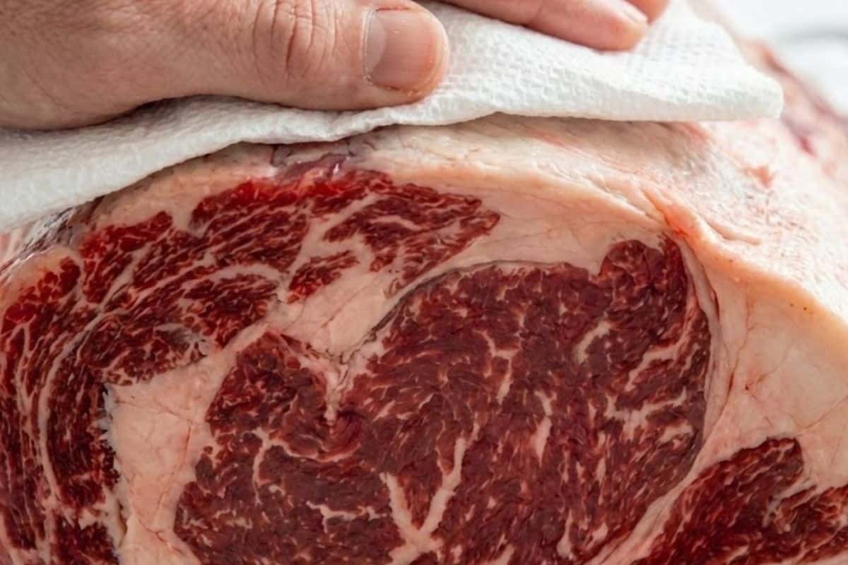 Remove the prime rib from the fridge at least 3 hours before roasting. Pat it dry with paper towels