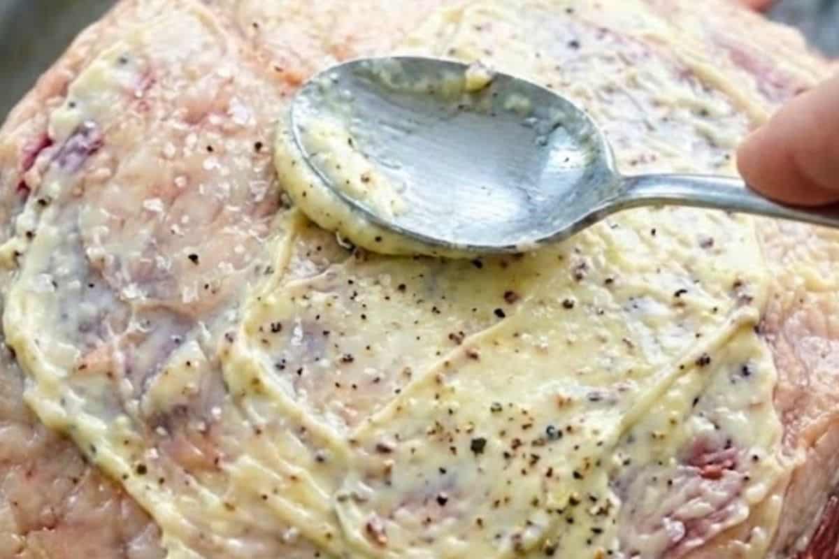 Rub the remaining garlic butter over the top and sides of the meat. Season all over with the remaining