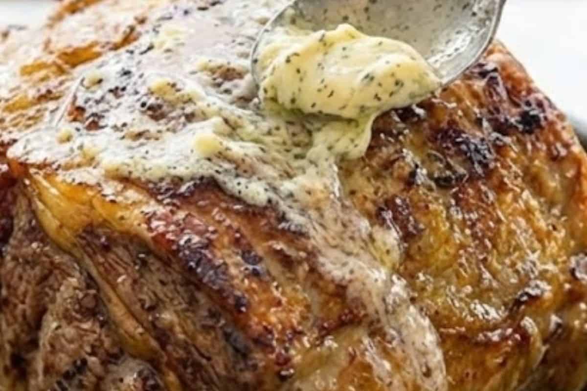 Carefully remove the roast, spread with the rest of the garlic butter,