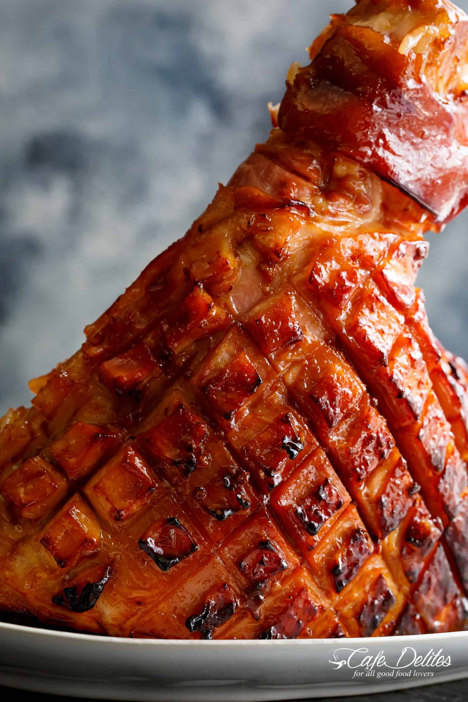 Baked Maple Glazed Ham on a serving plate glazed
