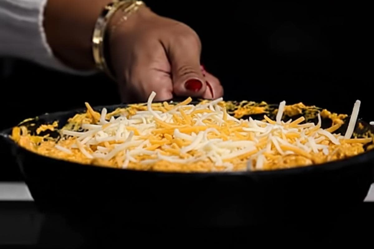 Sprinkled the sauce with cheddar cheeses.