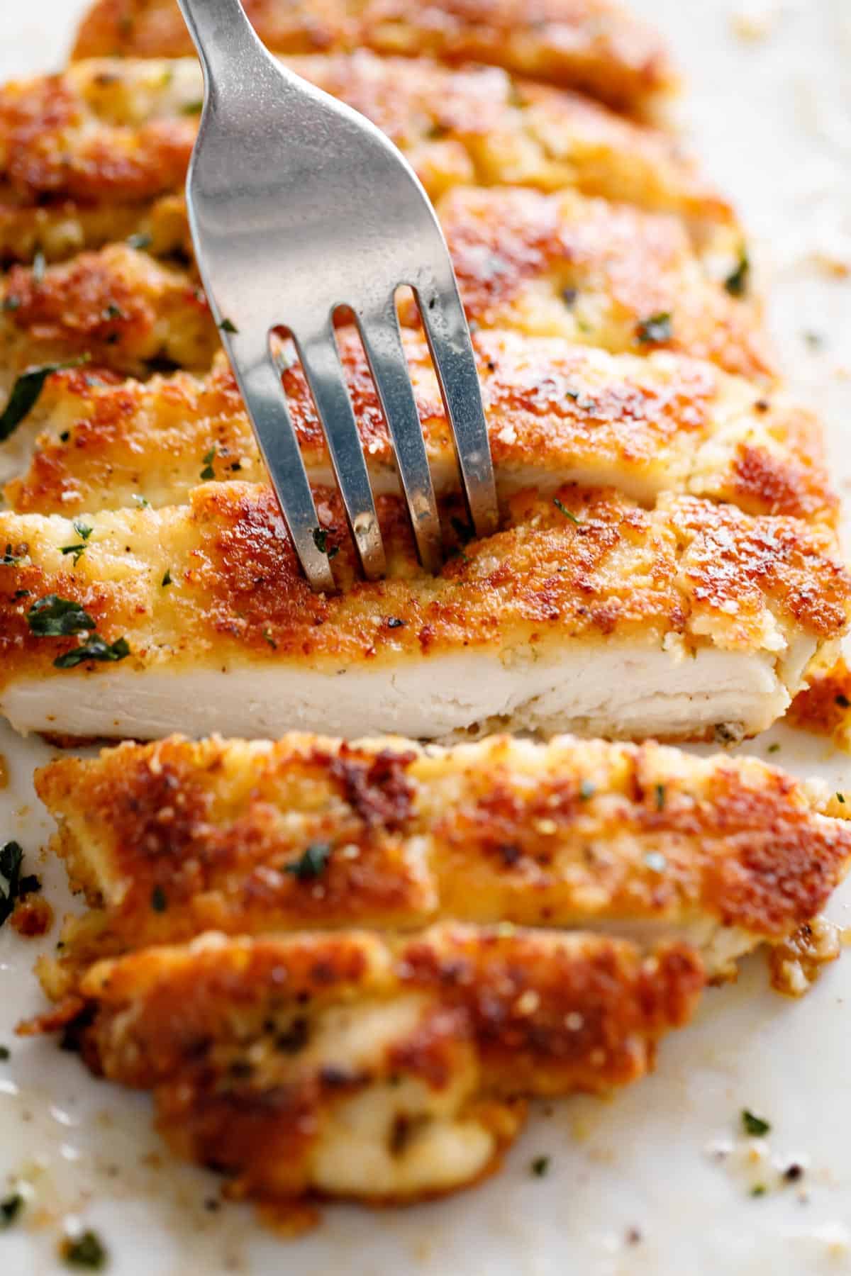 fork pierced in Parmesan Crusted Chicken