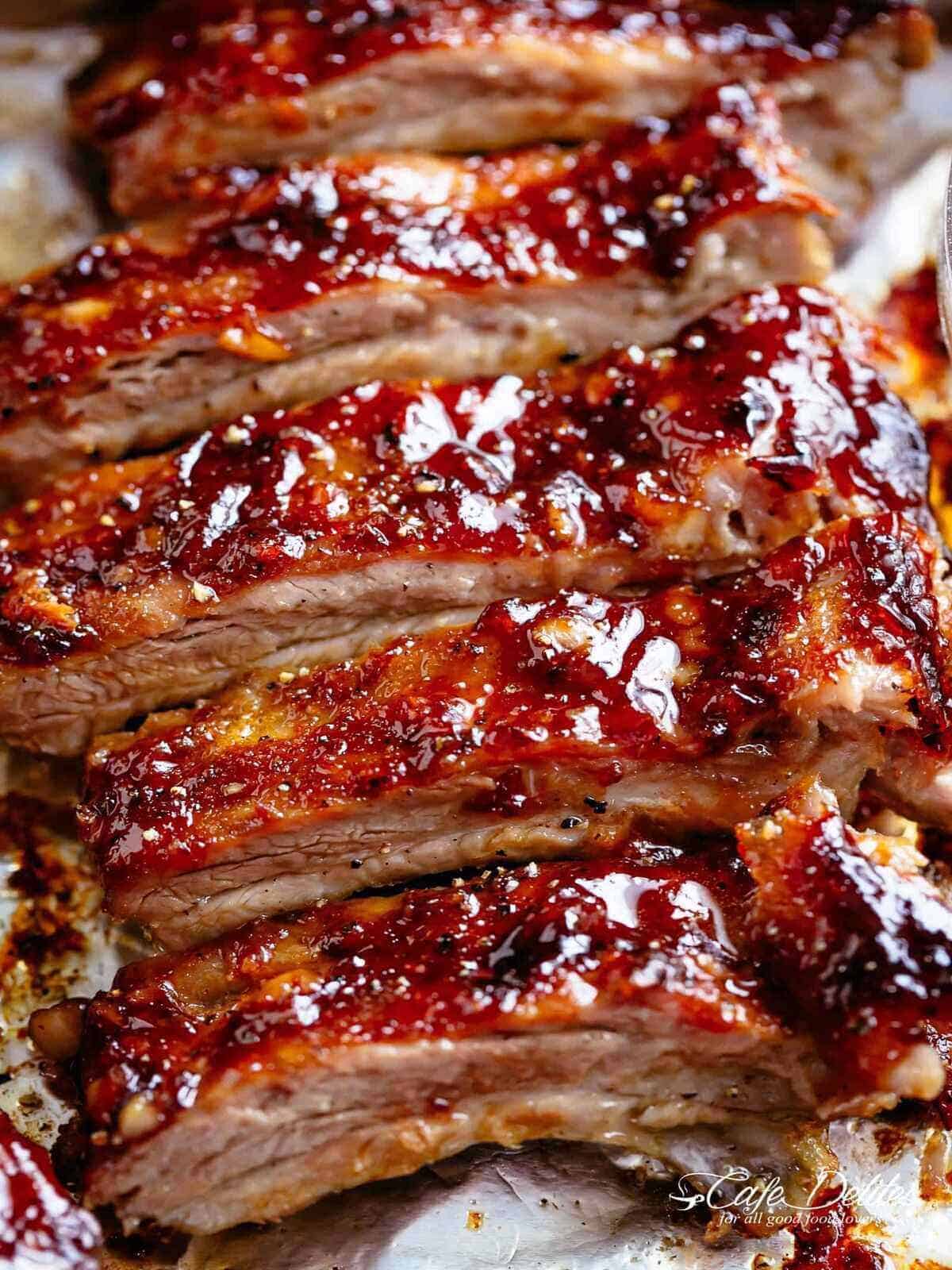 Barbecue Ribs | cafedelites.com Close-up image of juicy barbecue ribs, dripping in sauce, freshly removed from the oven.