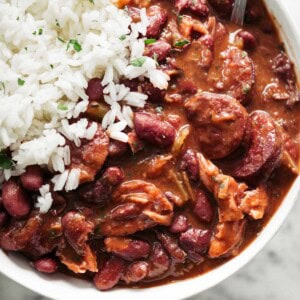 Hot Red beans and rice in a bowl with a spoon.