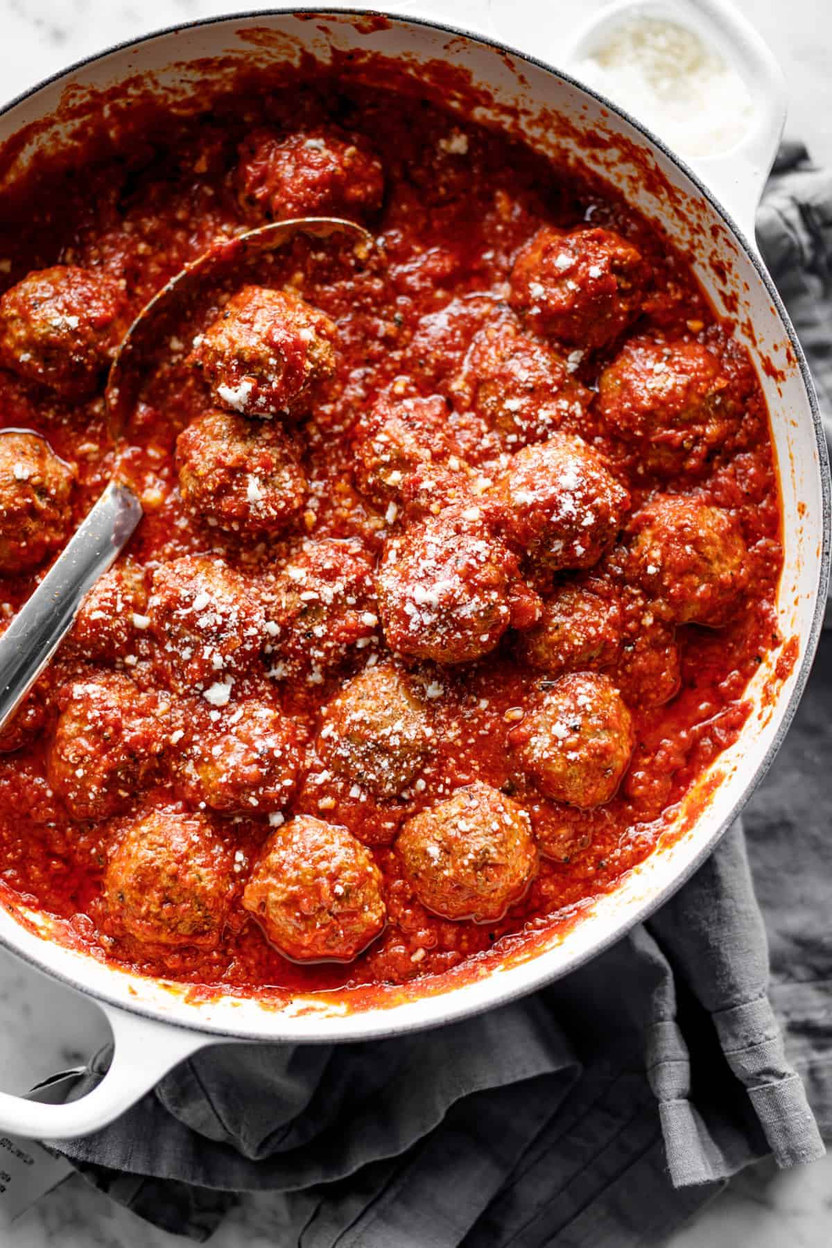 Baked Meatballs in vessel with spoon