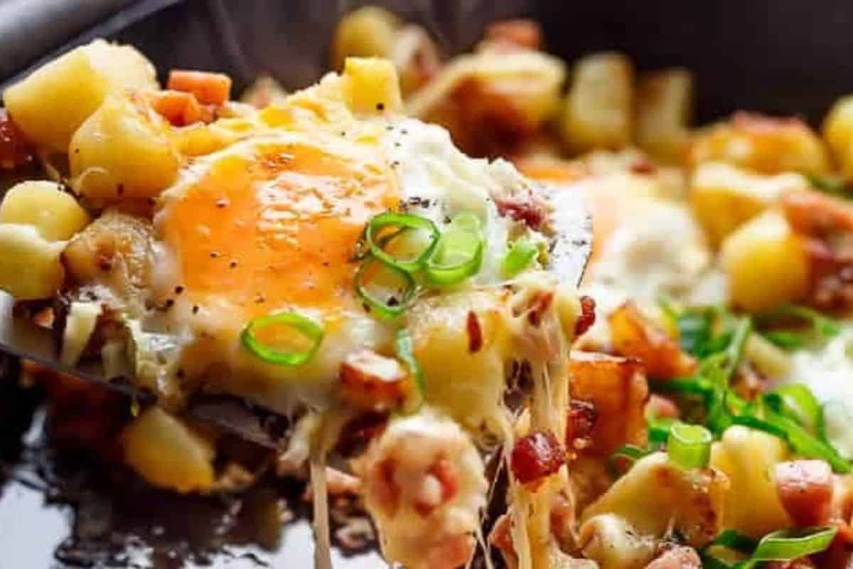 Make four wells in the potato mixture, crack in the eggs, and sprinkle mozzarella around them. Return to the oven until the whites are set.