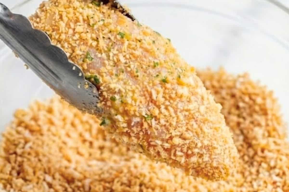 Remove each tender from the egg mixture and press them firmly into the breadcrumb mixture