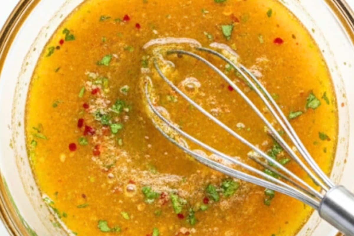 In a small bowl, whisk olive oil, lime juice, cilantro, garlic, brown sugar, red chili flakes, cumin, and salt