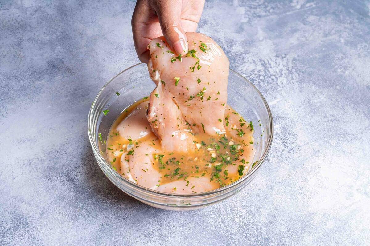chicken being marinated