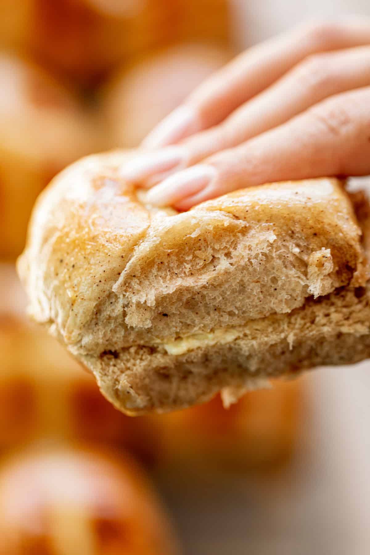 Holding Hot Cross Buns in fingers