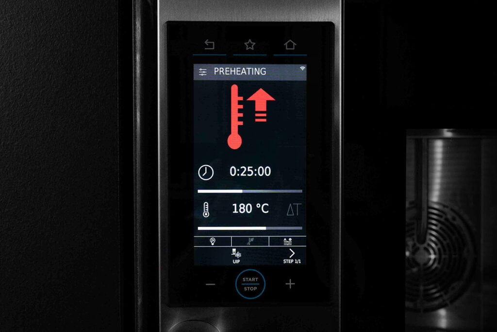 a screen on an electric oven showing the oven heating up to temprature