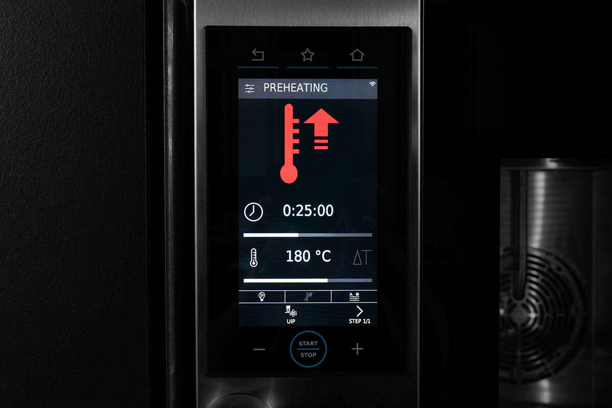 a screen on an electric oven showing the oven heating up to temprature
