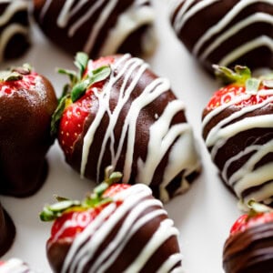 A close up image of a strawberry covered in chocolate.