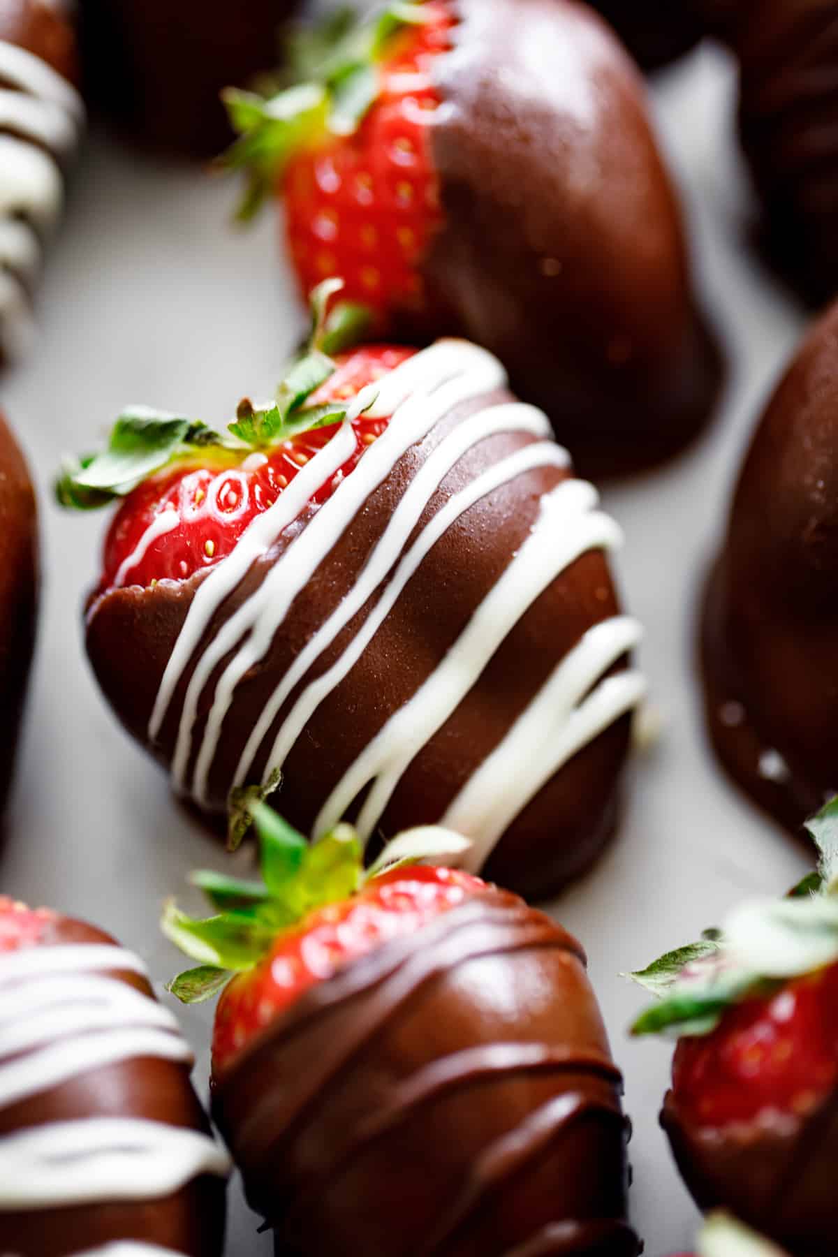 A close up image of a chocolate covered strawberry.