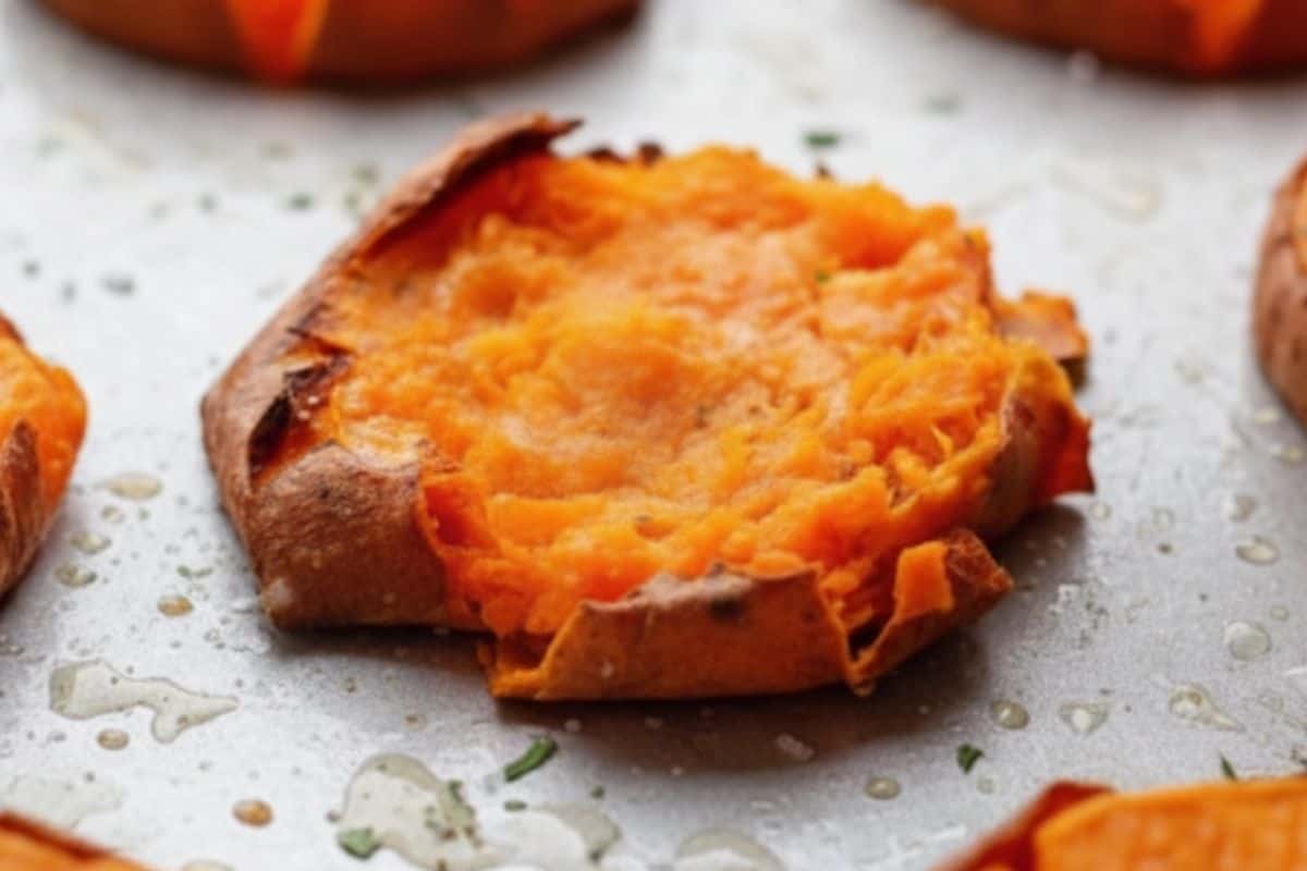 Use a fork and gently press down each sweet potato until slightly flattened.