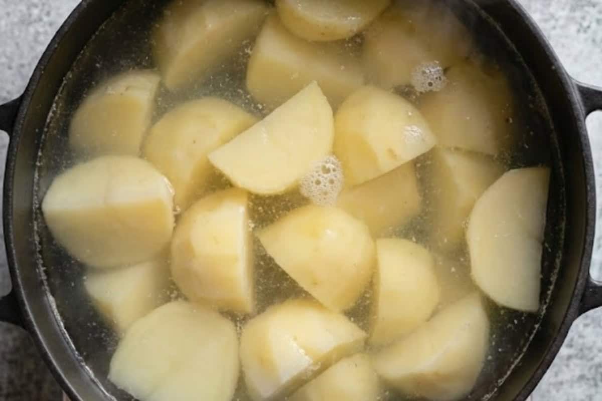 Place the potatoes into a large pot and cover with cold salted water and boil.