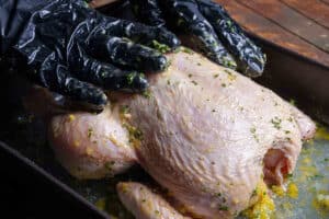 Rubbing ingredients in the chicken
