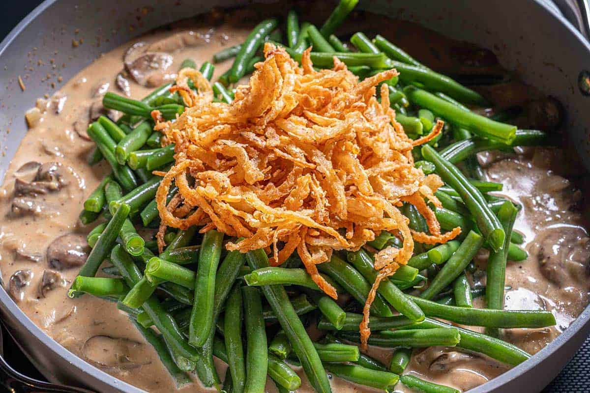 Mushroom soup combined with green beans and fired onion rings on the top
