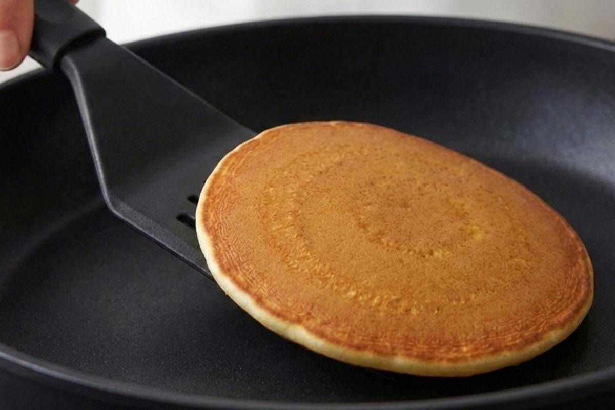 Flipping the pancake.