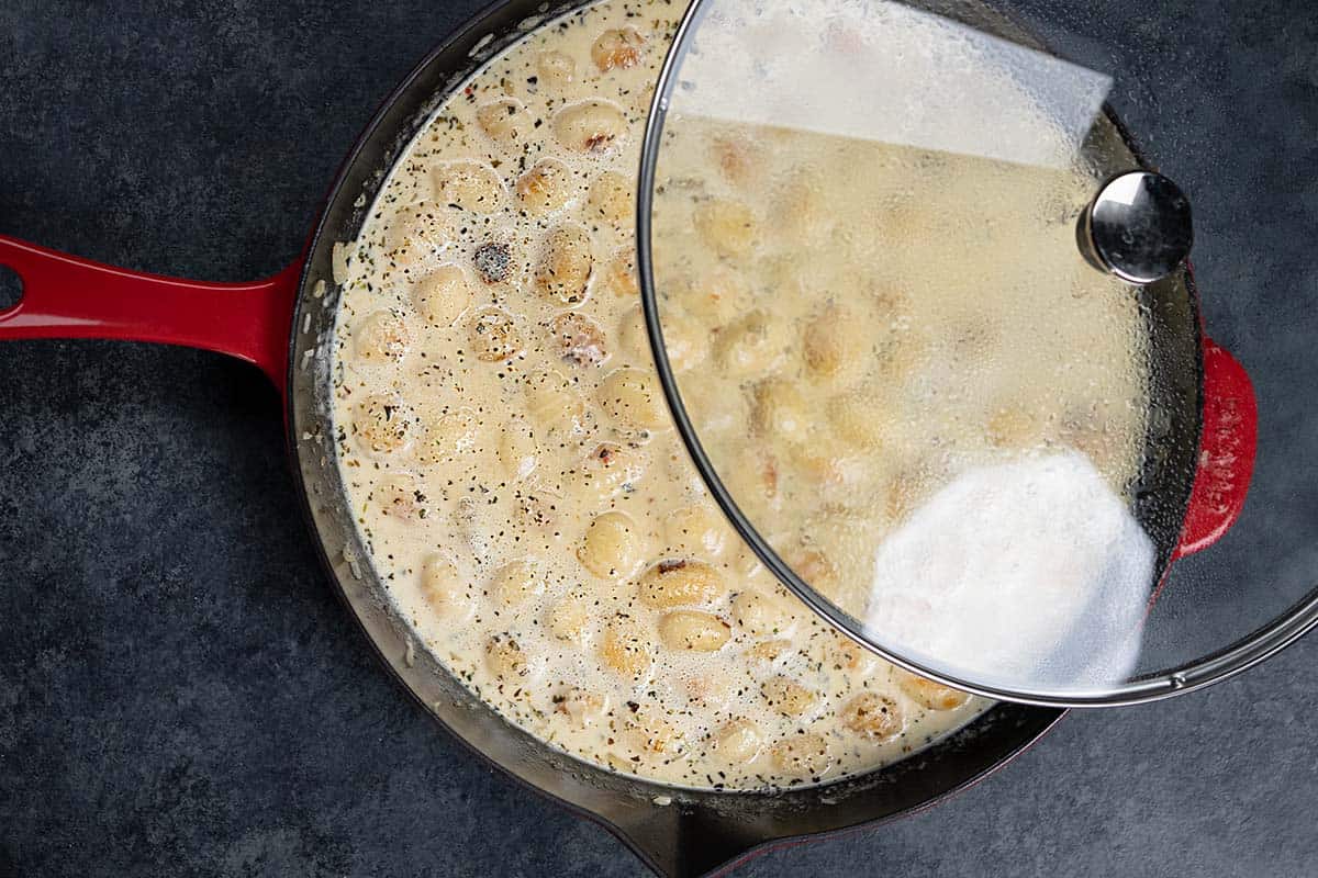 covering the boiling cream before adding sun-dried tomatoes
